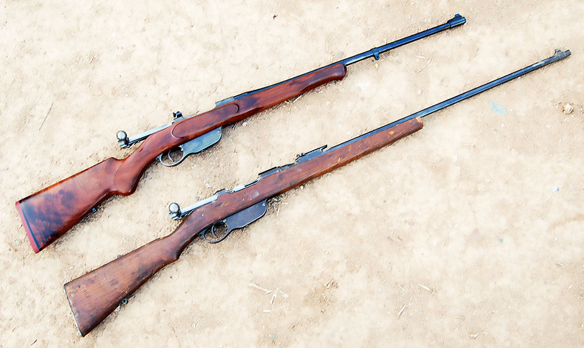 The custom straight pull (top) and the rifle identical to the one from which it came (bottom). There are better uses for rifled barrels and good walnut.